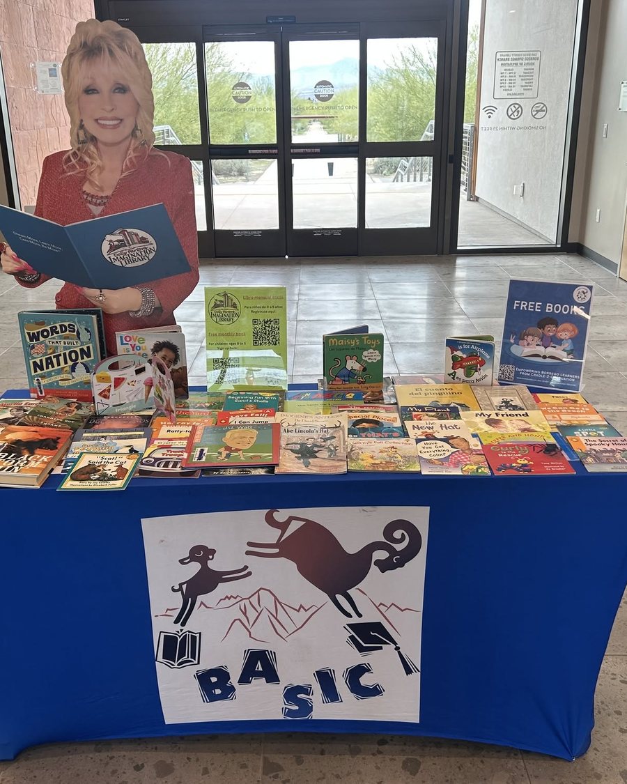 A table of free picture books beside a BASIC banner at the Borrego Springs library