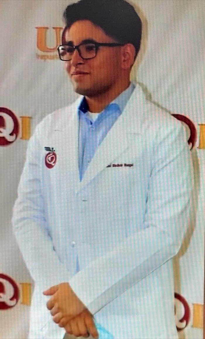 A BASIC scholar in a white coat at his medical school white-coat ceremony